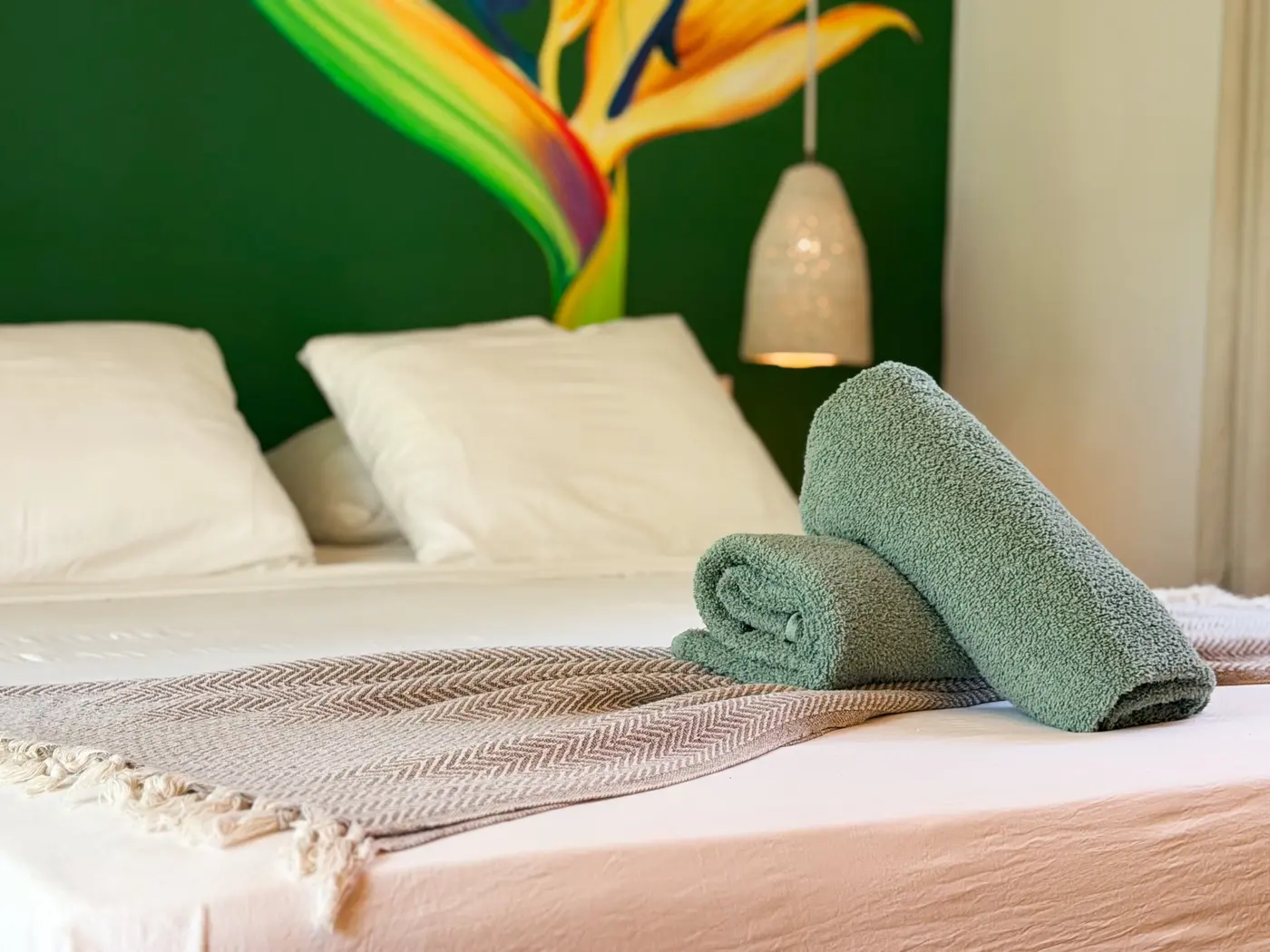 Fresh towels prepared on the queen-size bed